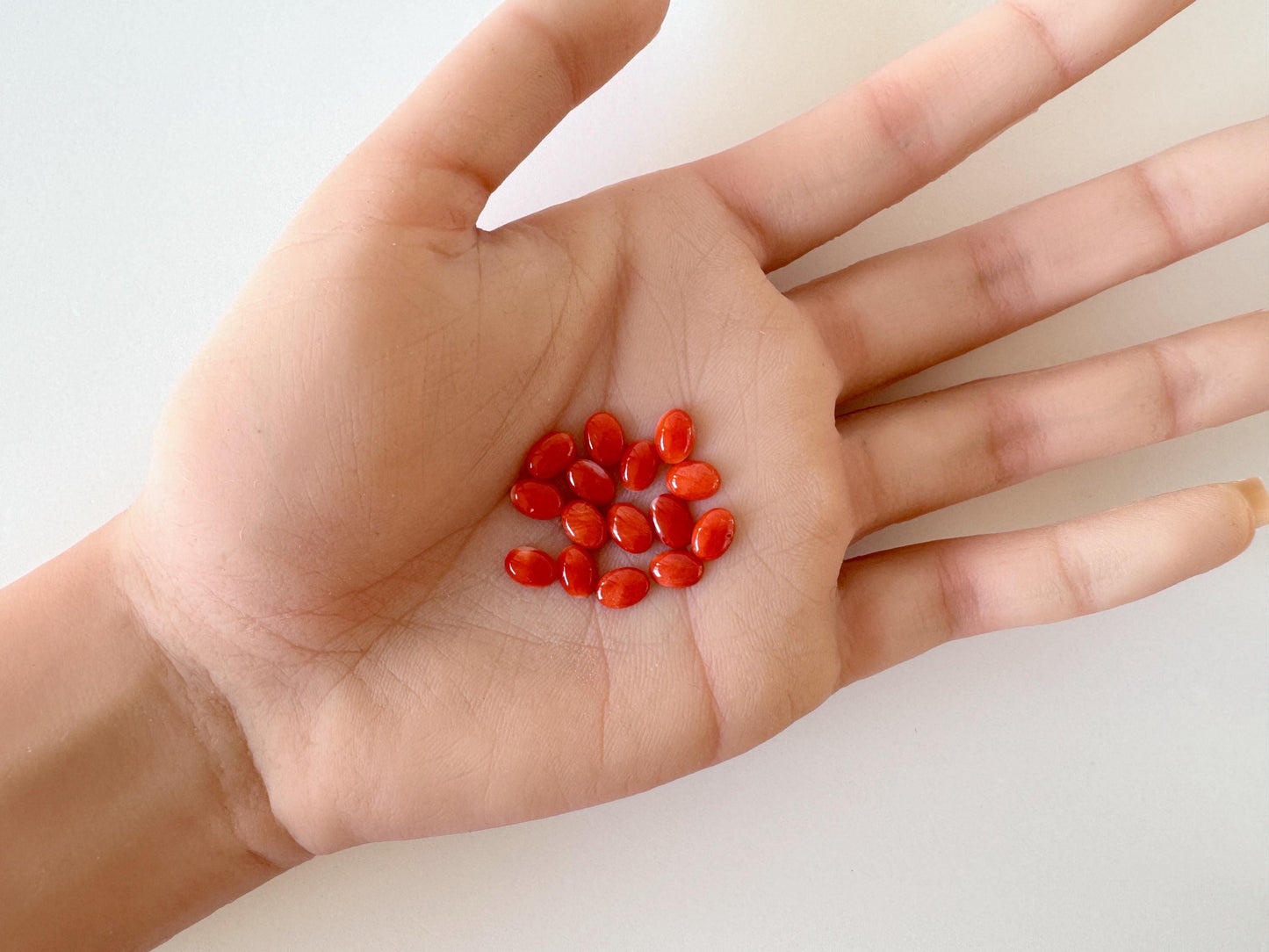 Natural Japanese Aka (Red) Coral Cabochons: 7x5mm Oval, Set of 15