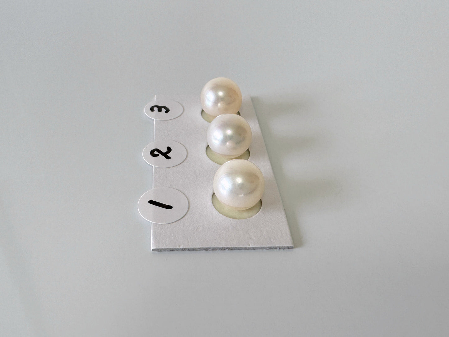 a group of pearls sitting on top of a piece of paper