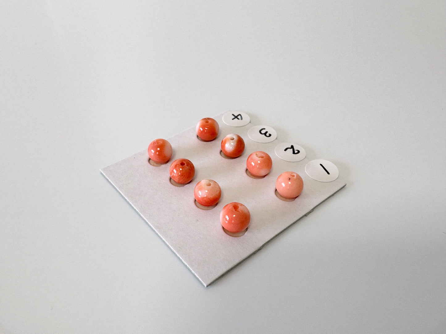 Momo Coral Round Beads 6-6.5mm: Natural Orange Half Drilled Pair