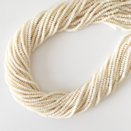 A bundle of white beads arranged in a circular pattern.