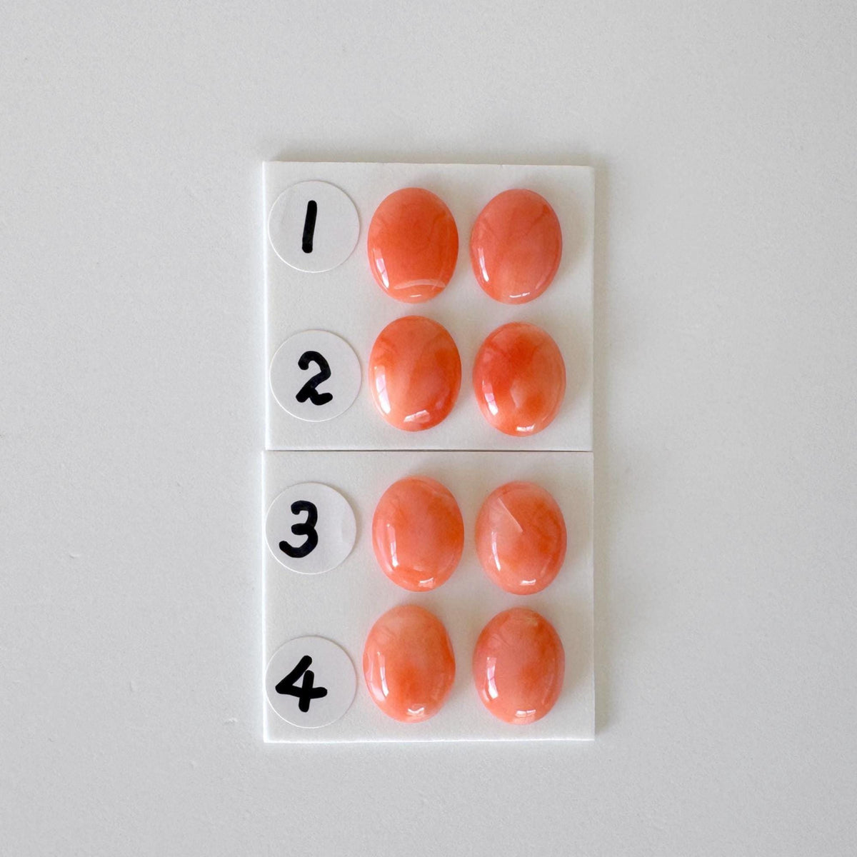 Deep Sea Coral Cabochons: Natural Orange/Pink Oval Gemstones, 10x8mm (2 pcs), Value Priced for Reason of Natural Defects