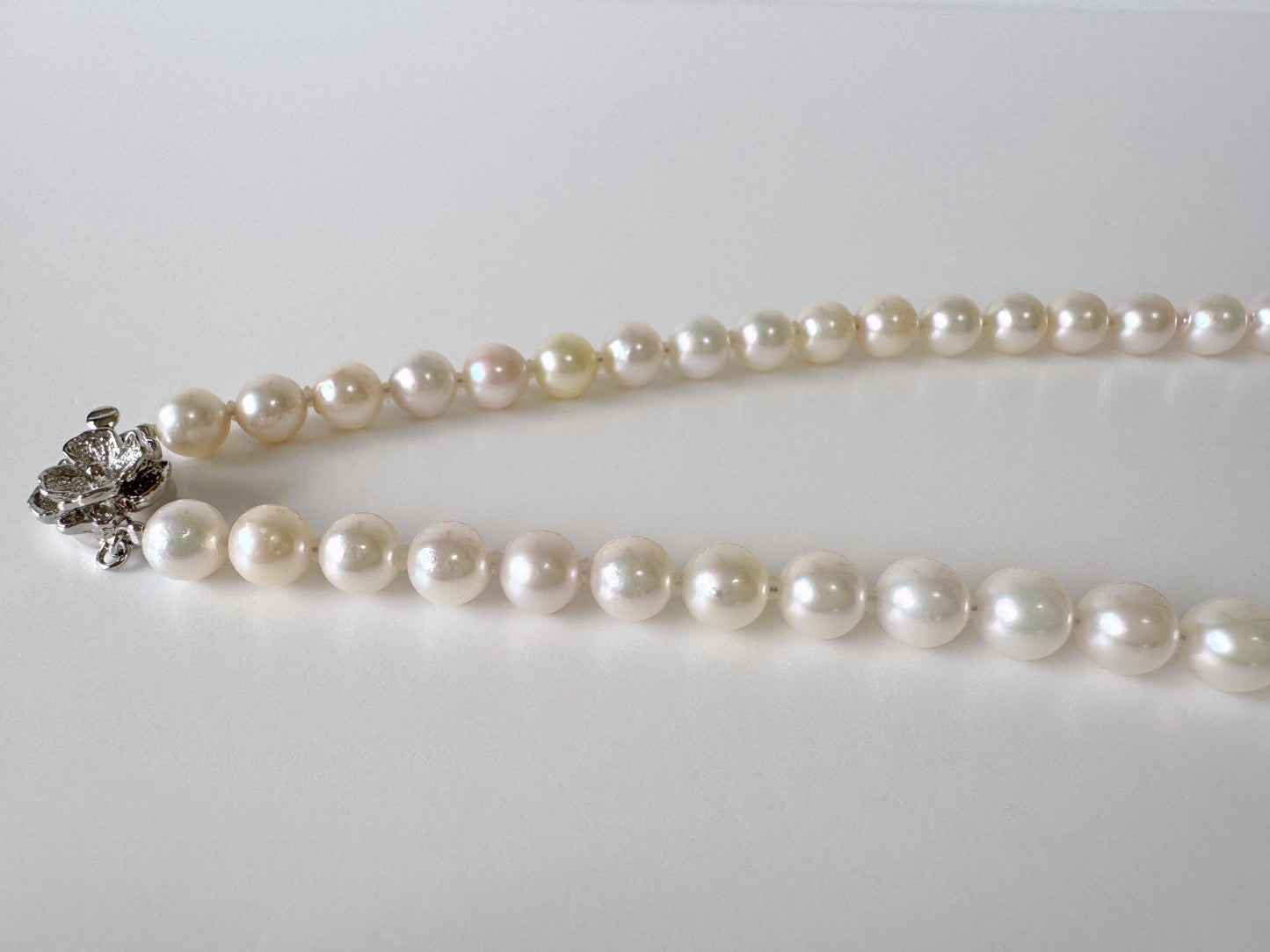 Japanese Akoya Pearl Necklace: White/Slightly Pink 6.9-9.3mm Cultured Strand, Silver Clasp | Saltwater Gems, 47cm Length