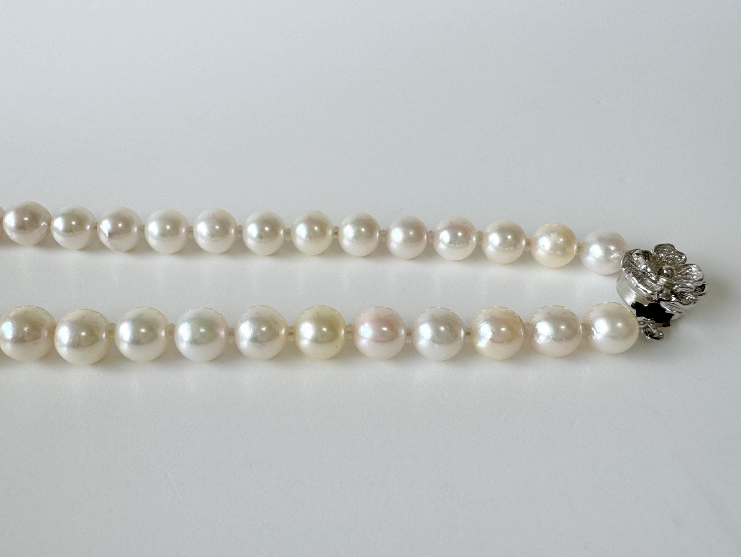 Japanese Akoya Pearl Necklace: White/Slightly Pink 6.9-9.3mm Cultured Strand, Silver Clasp | Saltwater Gems, 47cm Length