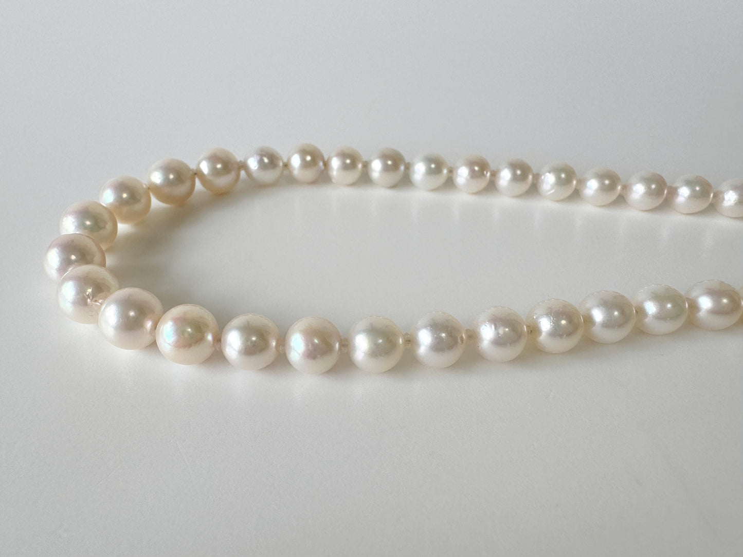 Japanese Akoya Pearl Necklace: White/Slightly Pink 6.9-9.3mm Cultured Strand, Silver Clasp | Saltwater Gems, 47cm Length