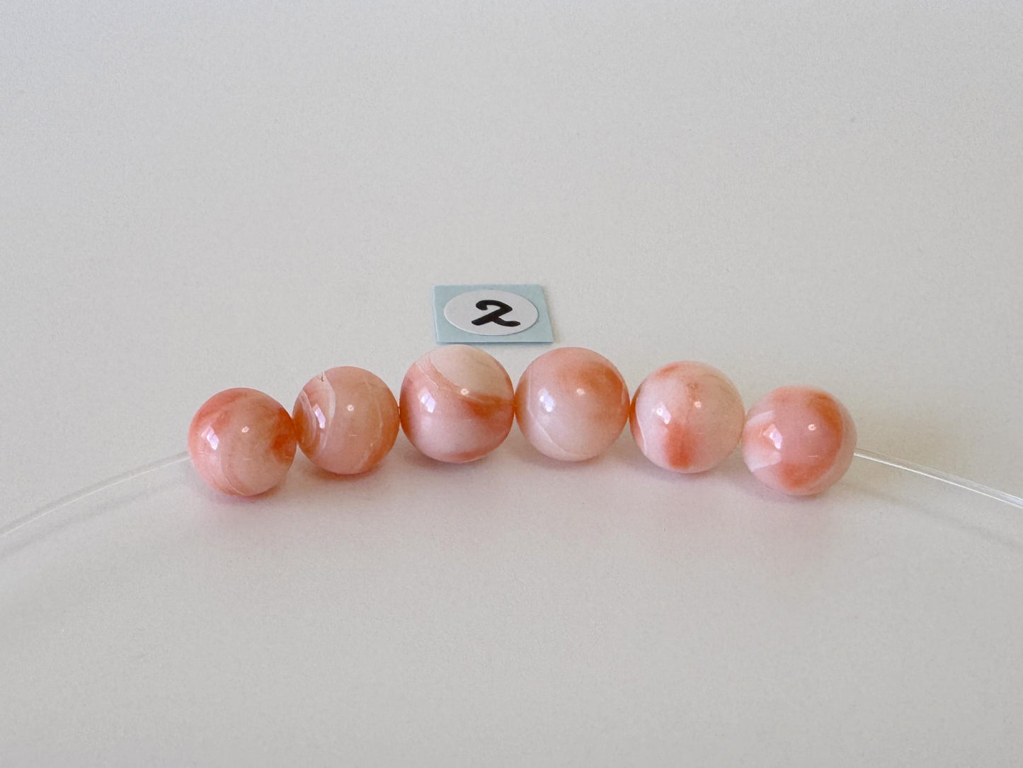 Short strand (6pc) of Natural Deep sea coral round beads 7.5-8.4mm, natural Pink/Orange color coral
