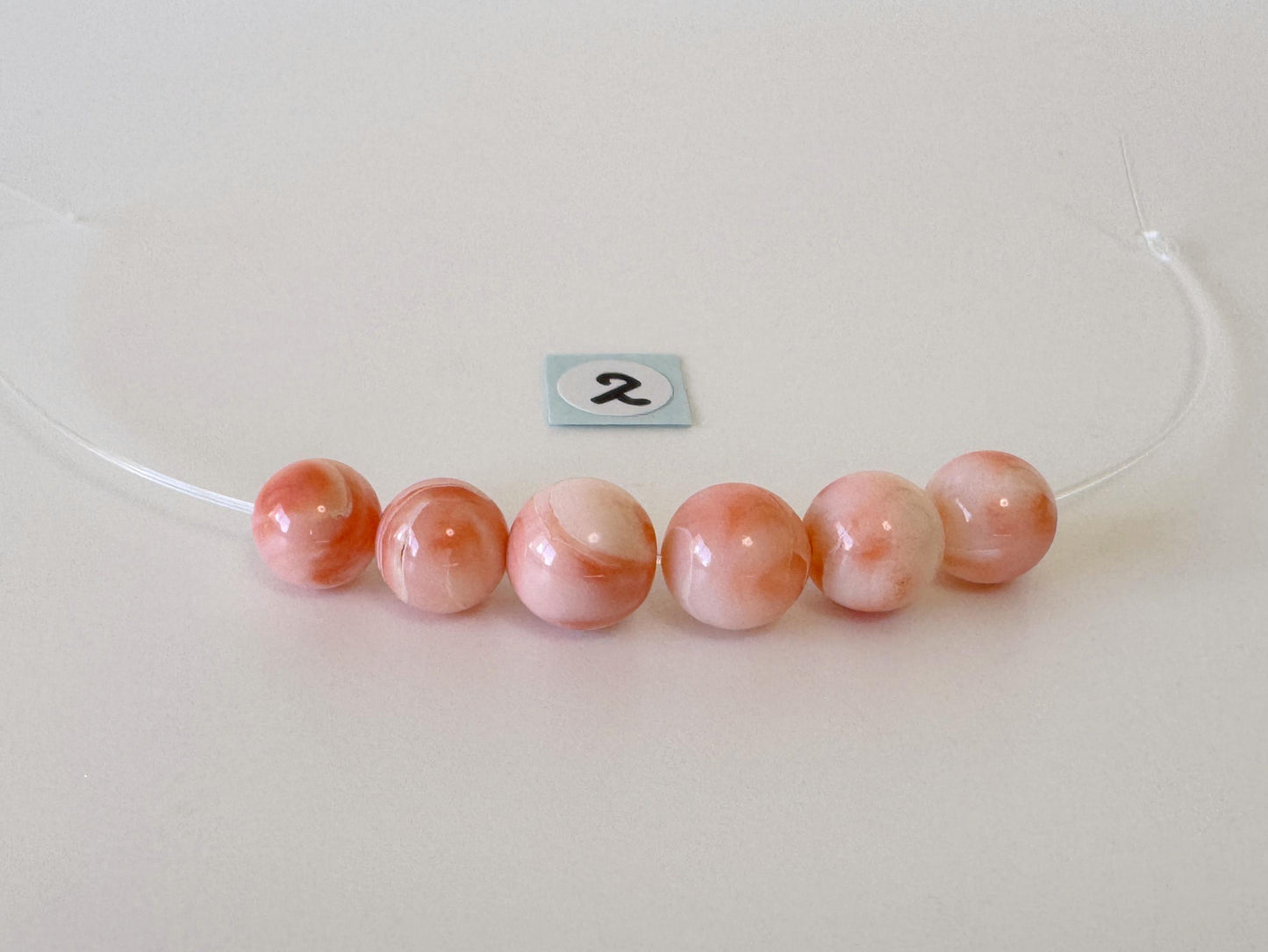 Short strand (6pc) of Natural Deep sea coral round beads 7.5-8.4mm, natural Pink/Orange color coral
