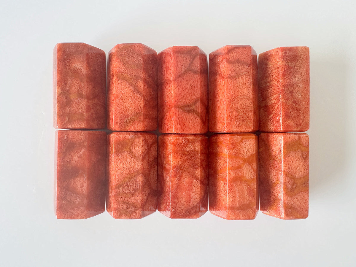 a collection of nine rectangular, orange-colored objects arranged in a grid-like pattern on a white background.