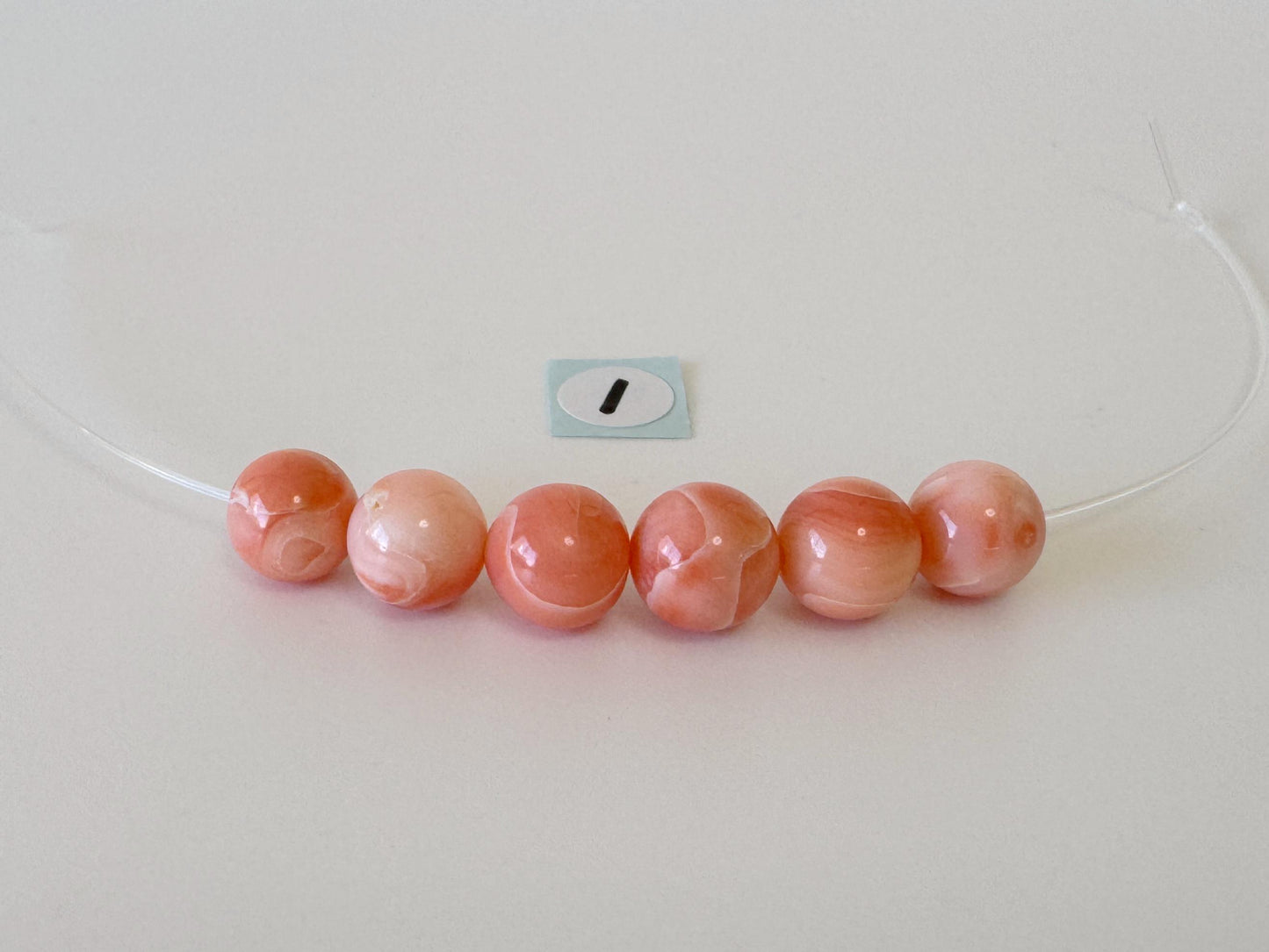 Short strand (6pc) of Natural Deep sea coral round beads 7.5-8.4mm, natural Pink/Orange color coral