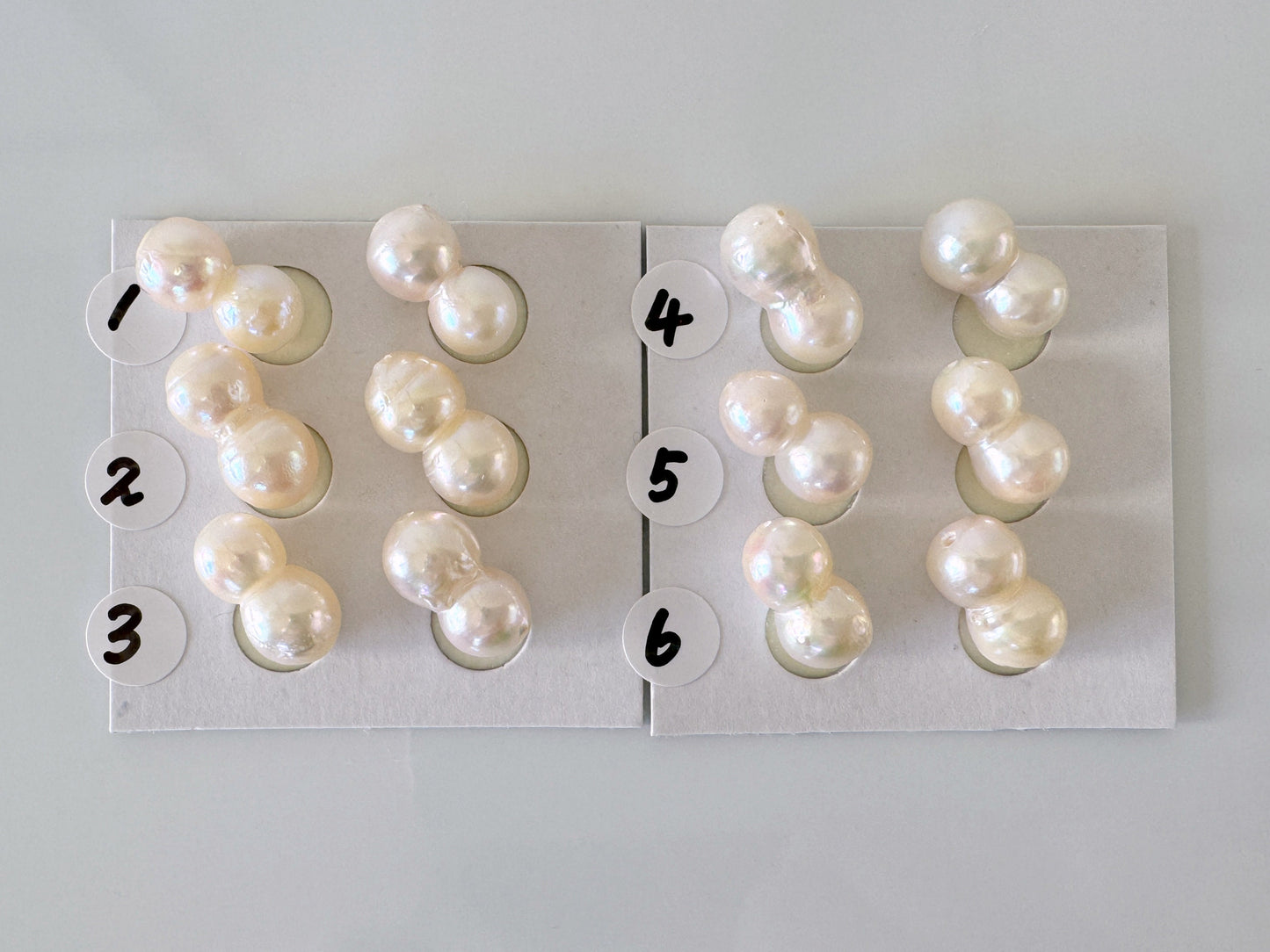 a group of pearls sitting on top of a piece of paper