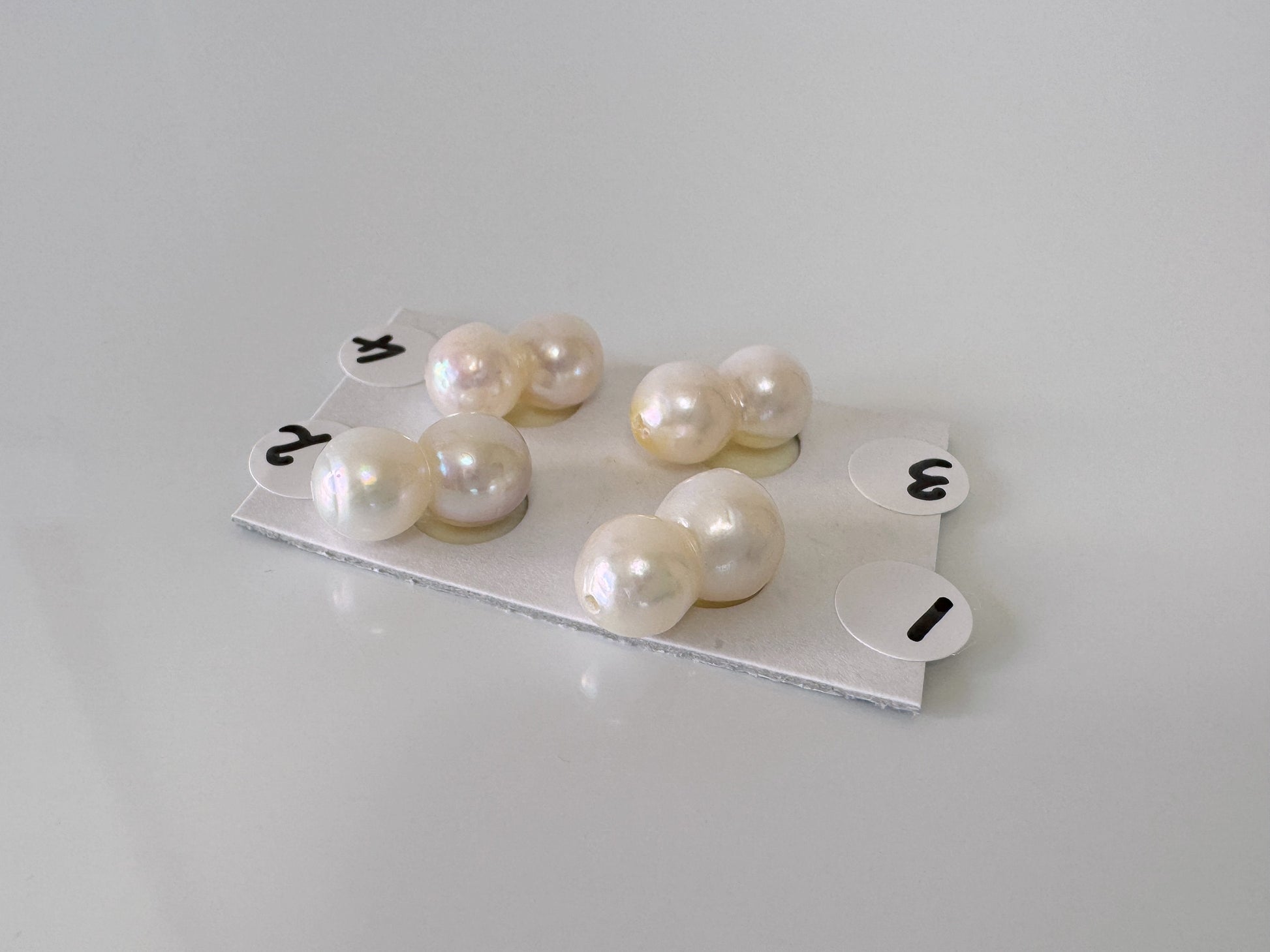 a group of pearls sitting on top of a white table