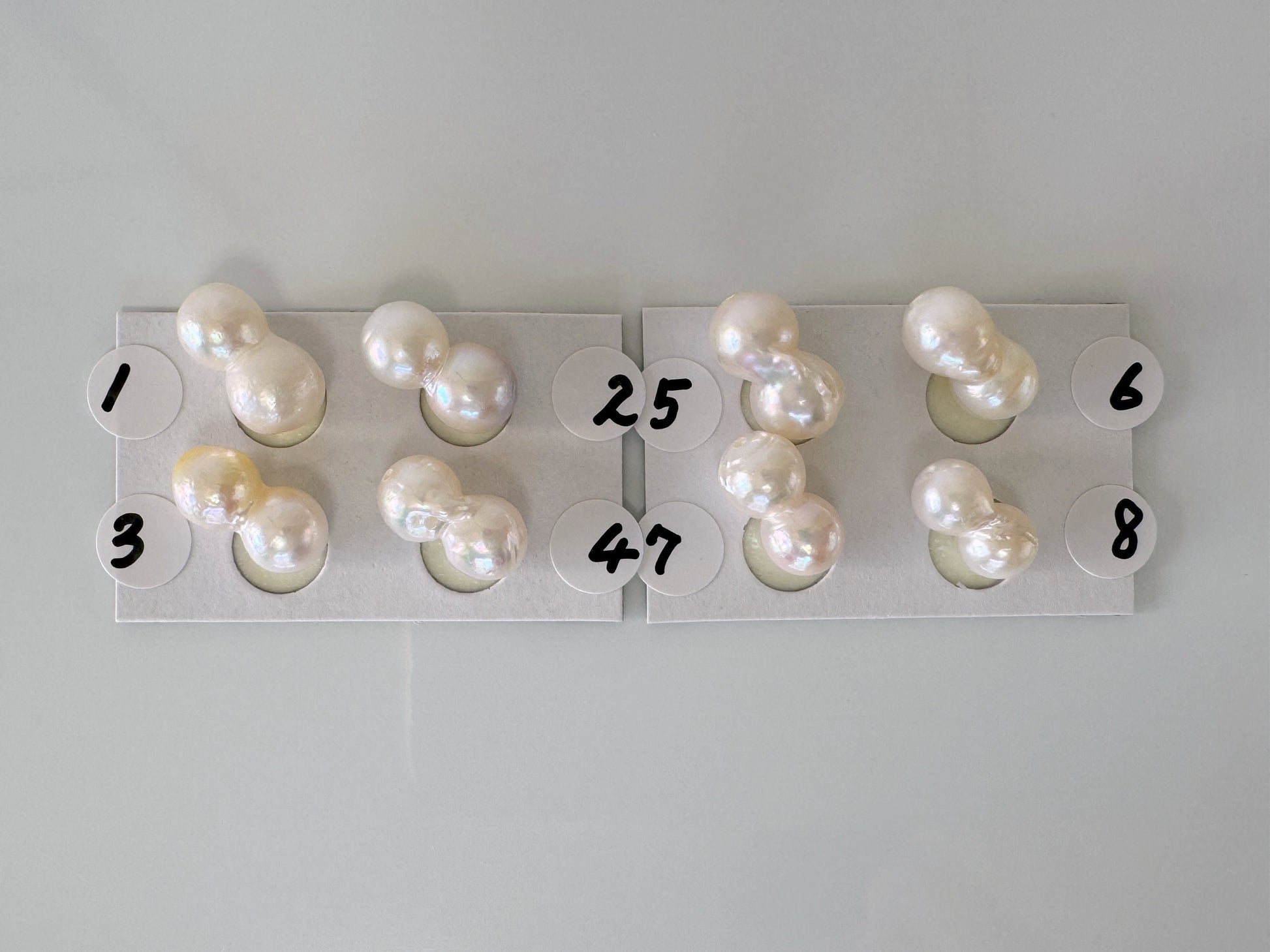 a group of pearls sitting on top of a white table