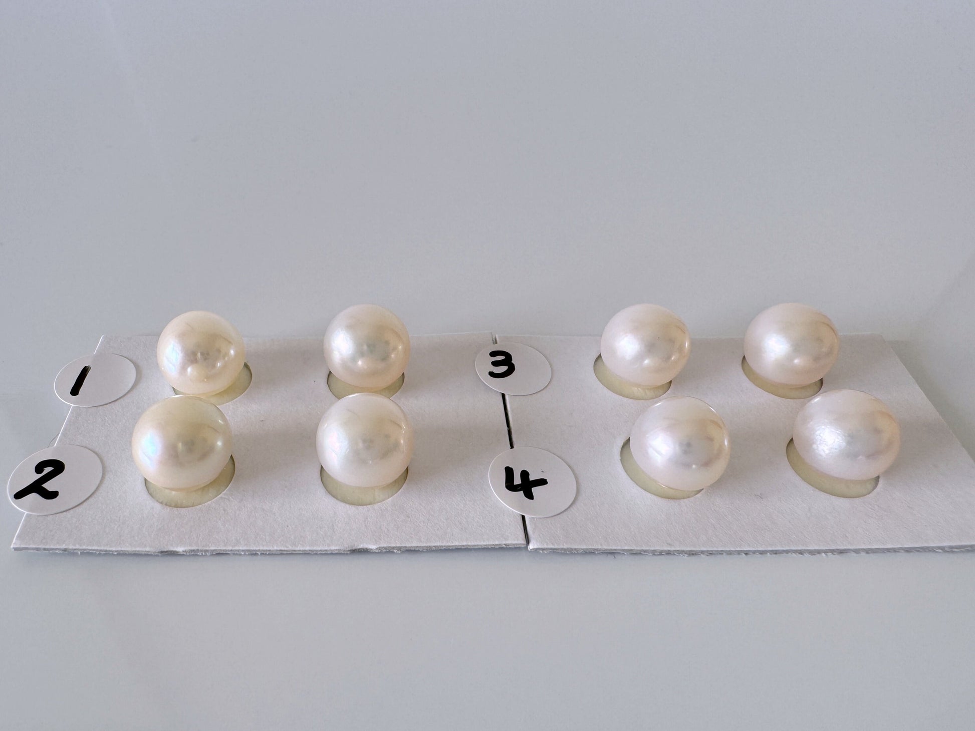 a group of pearls sitting on top of a piece of paper