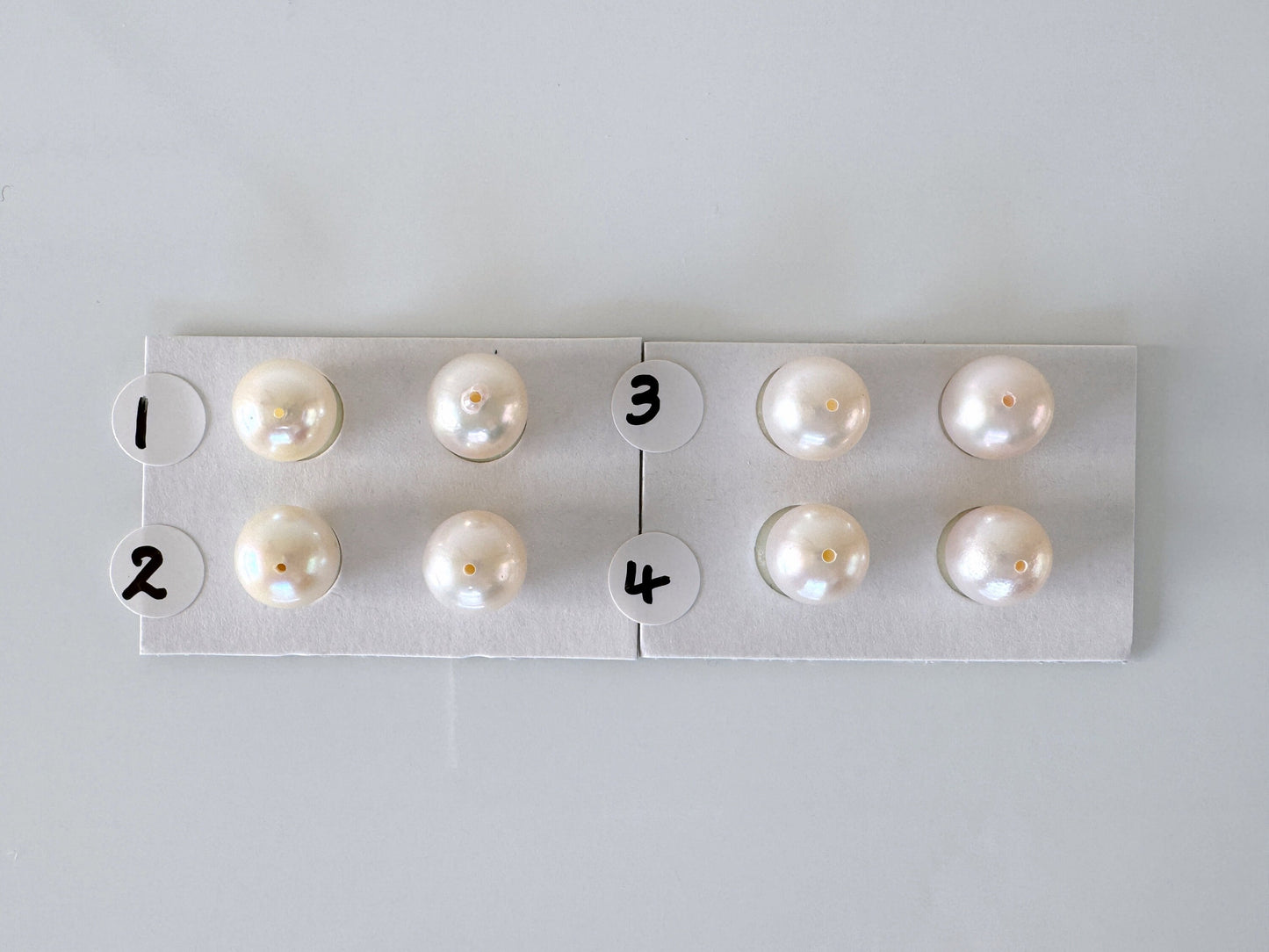 a group of pearls sitting on top of a piece of paper