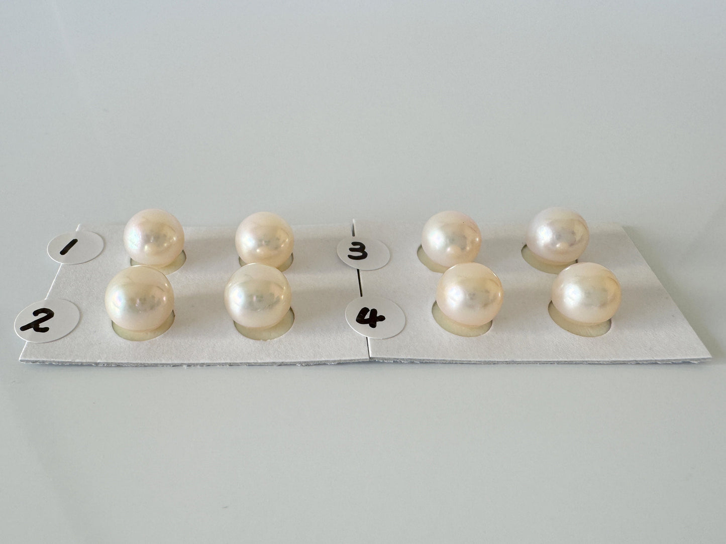 a group of pearls sitting on top of a piece of paper