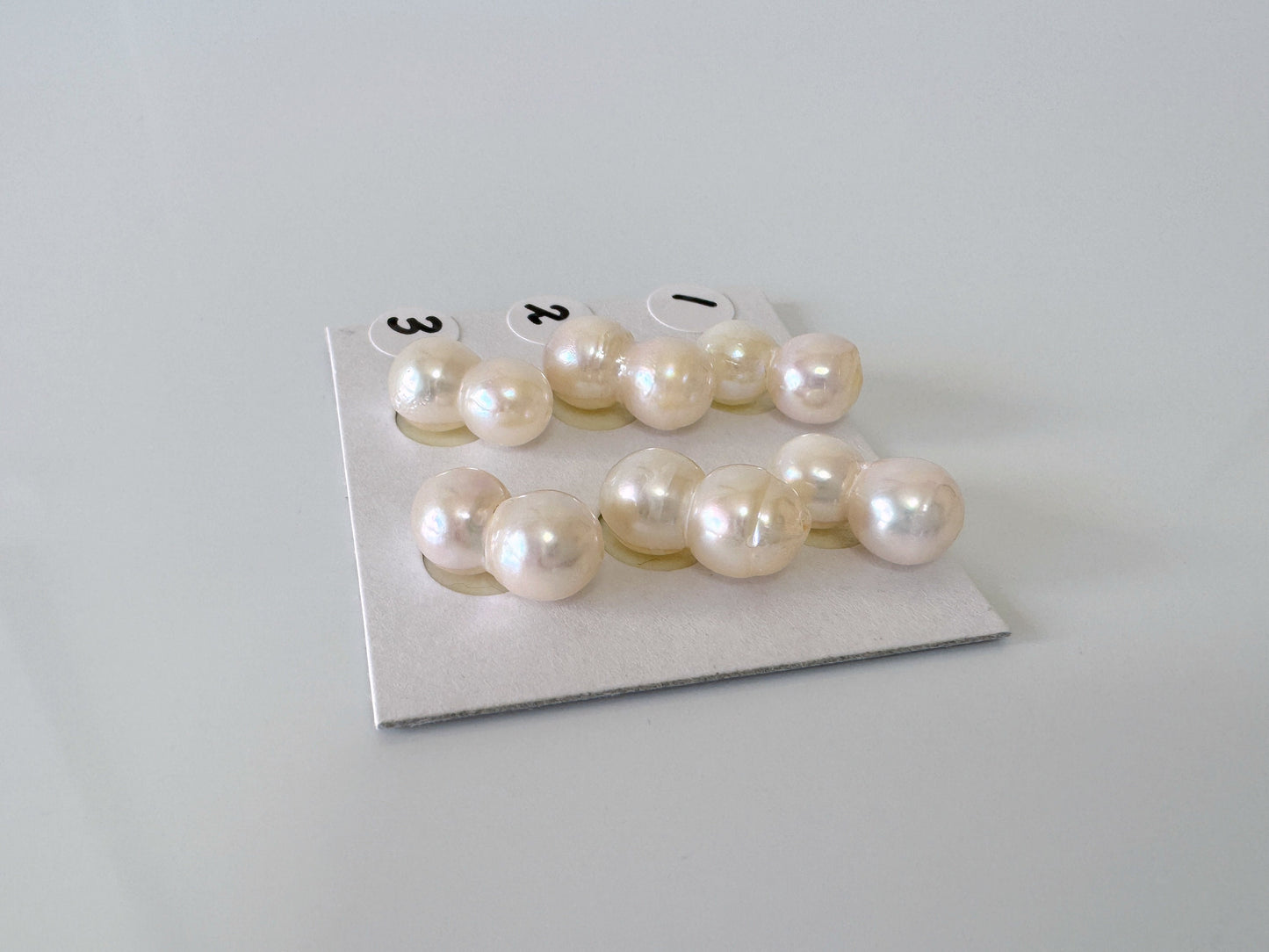 a group of pearls sitting on top of a piece of paper