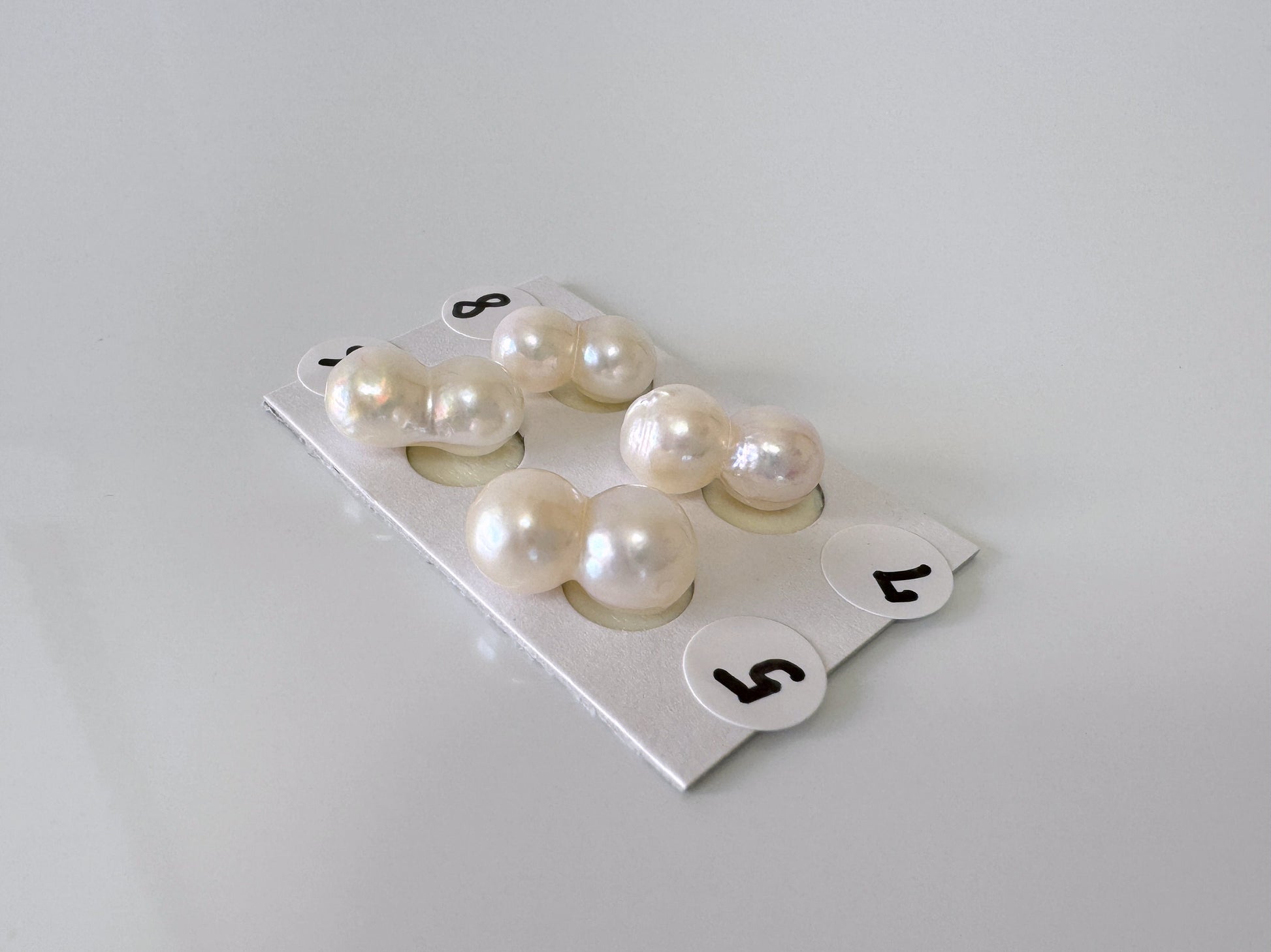 a group of pearls sitting on top of a white table