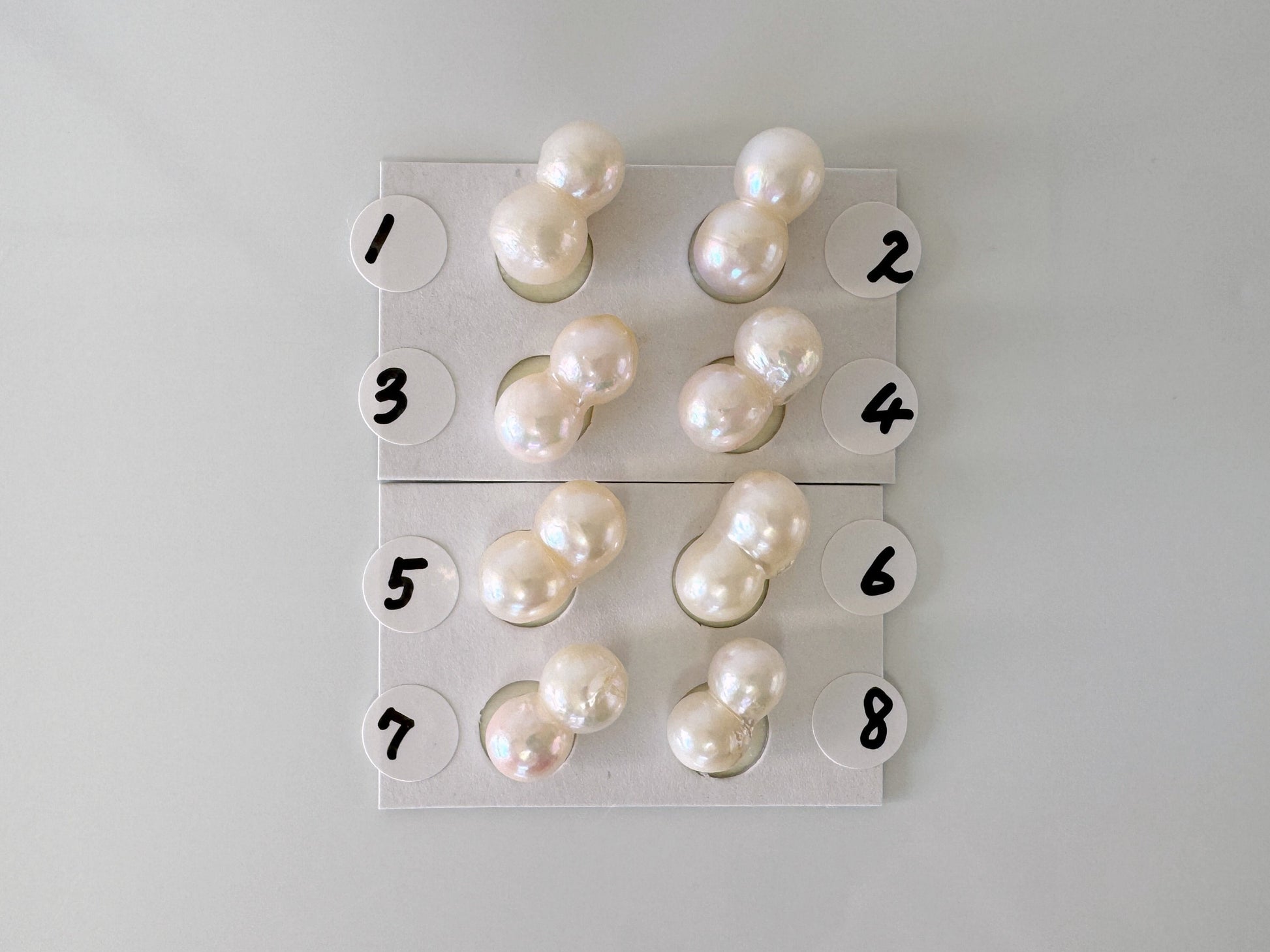 a group of pearls sitting on top of a white table