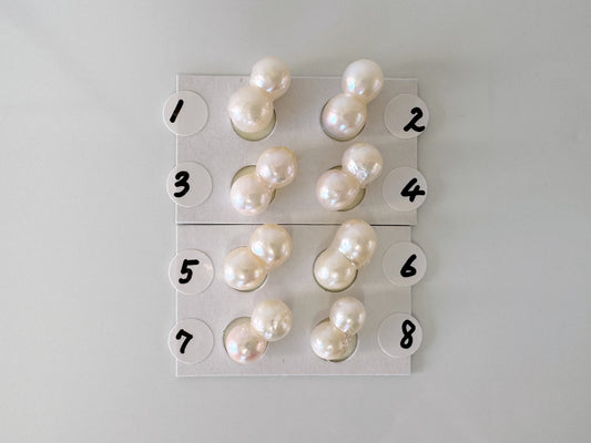 a group of pearls sitting on top of a white table