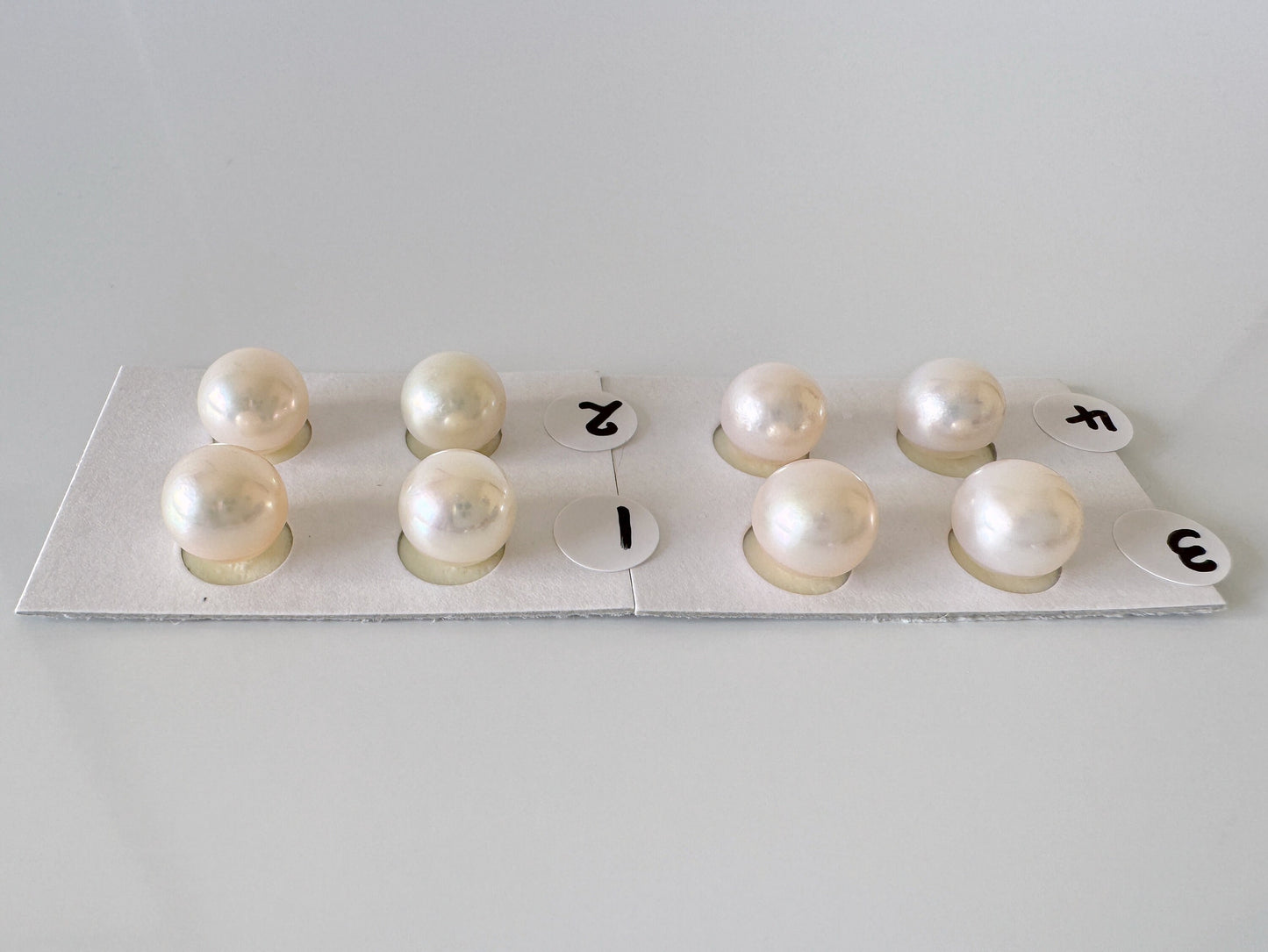 a group of pearls sitting on top of a piece of paper