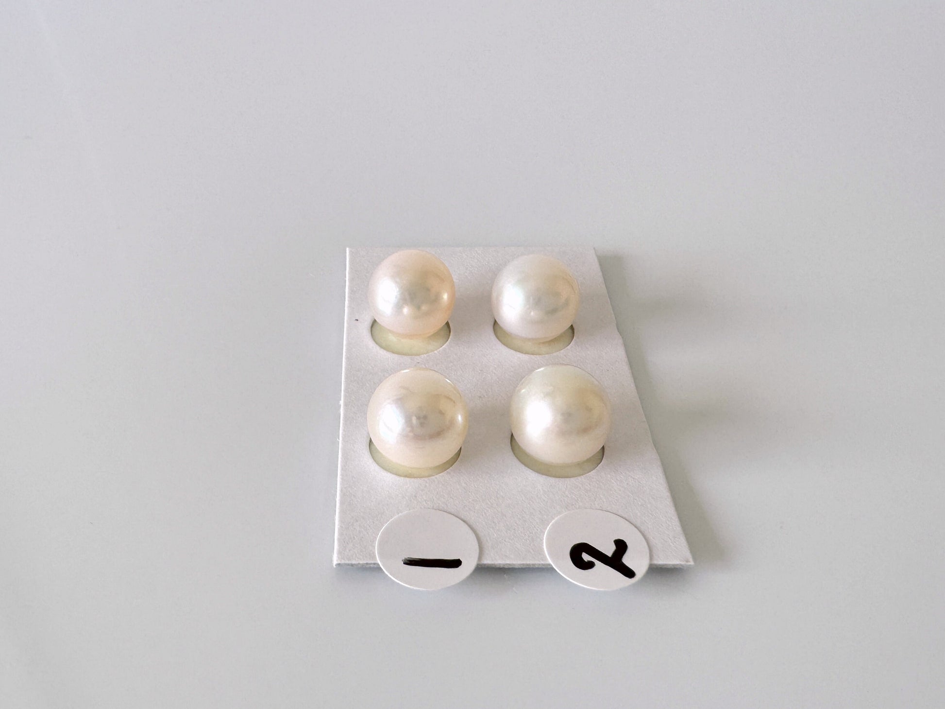 a group of pearls sitting on top of a white tray