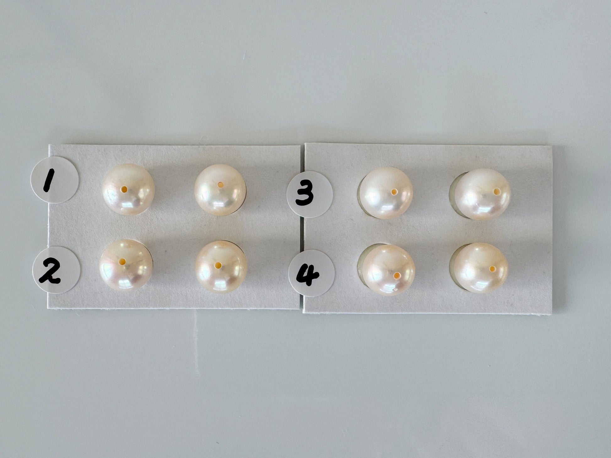 a group of pearls sitting on top of a piece of paper