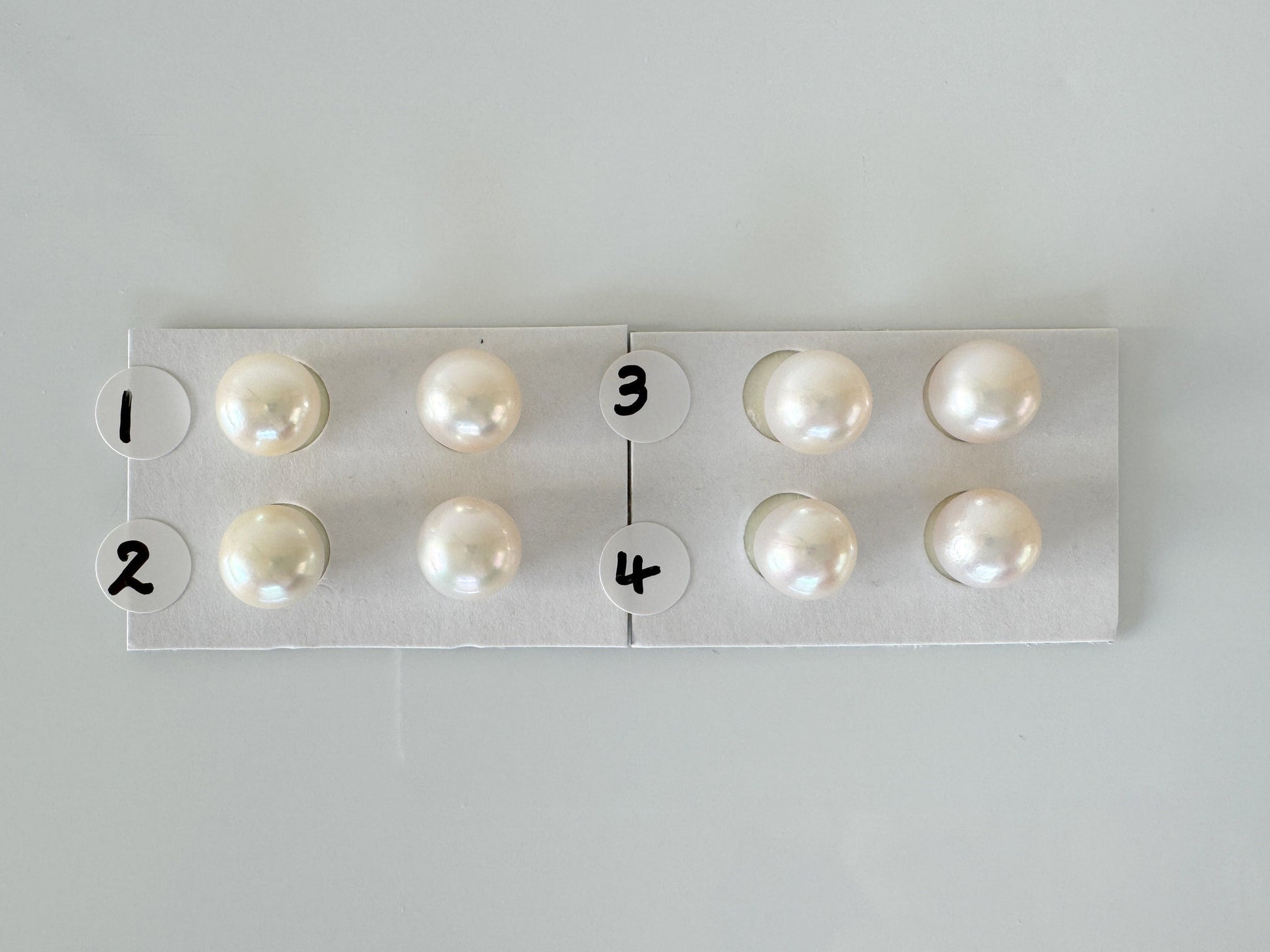 a group of pearls sitting on top of a piece of paper