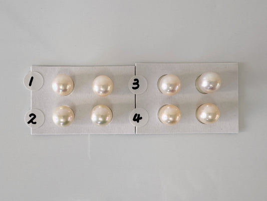 a group of pearls sitting on top of a white board