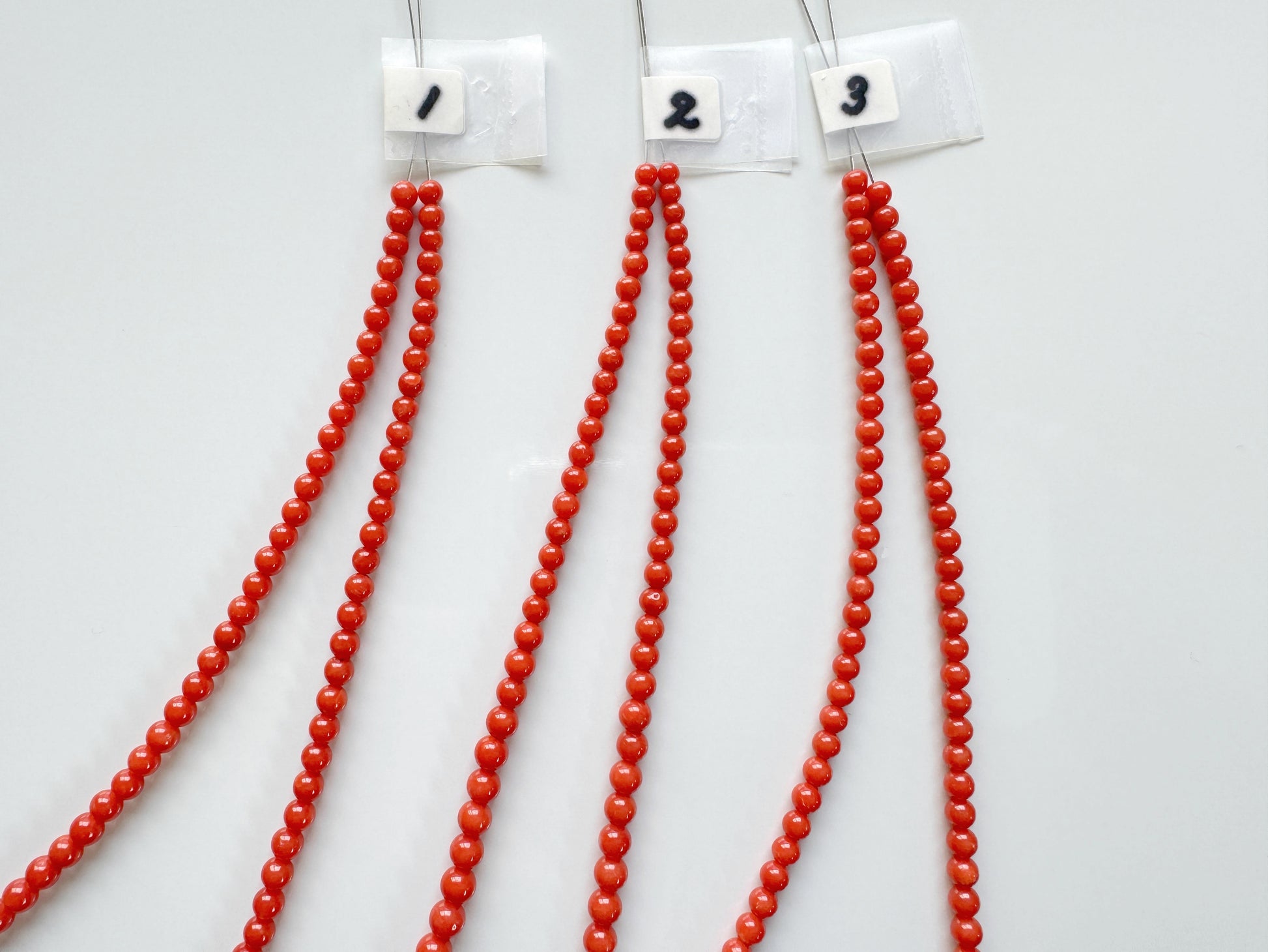 a group of red beads with numbers on them